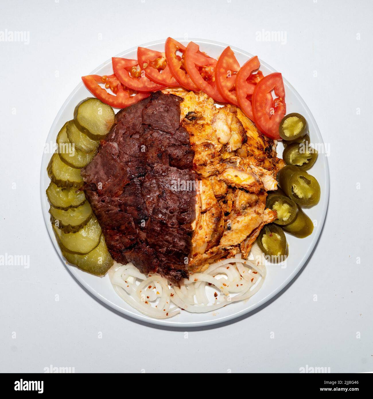 Mix Doner plate of chicken and beef meat in a Restaurant Stock Photo