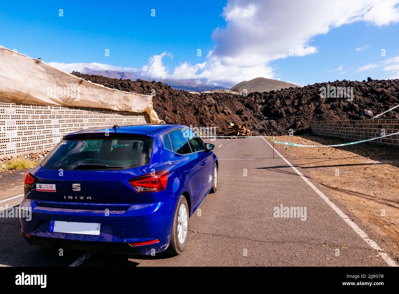 Closed road by the solidified lava river. Destruction caused by the lava river in the Aridane Valley. La Palma, Canary Islands, Spain Stock Photo