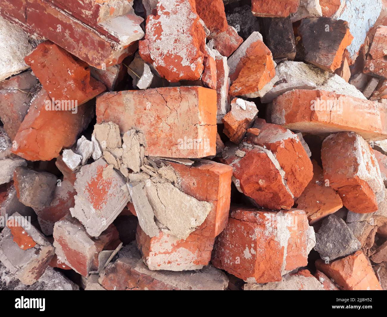 red brick background scattered old broken blocks Stock Photo