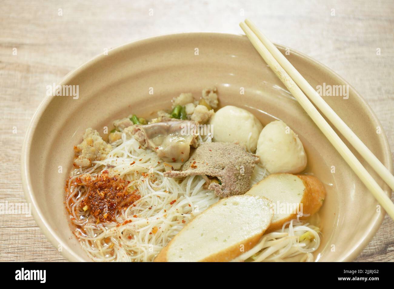 vermicelli rice noodles topping chop boiled pork and fish ball in soup