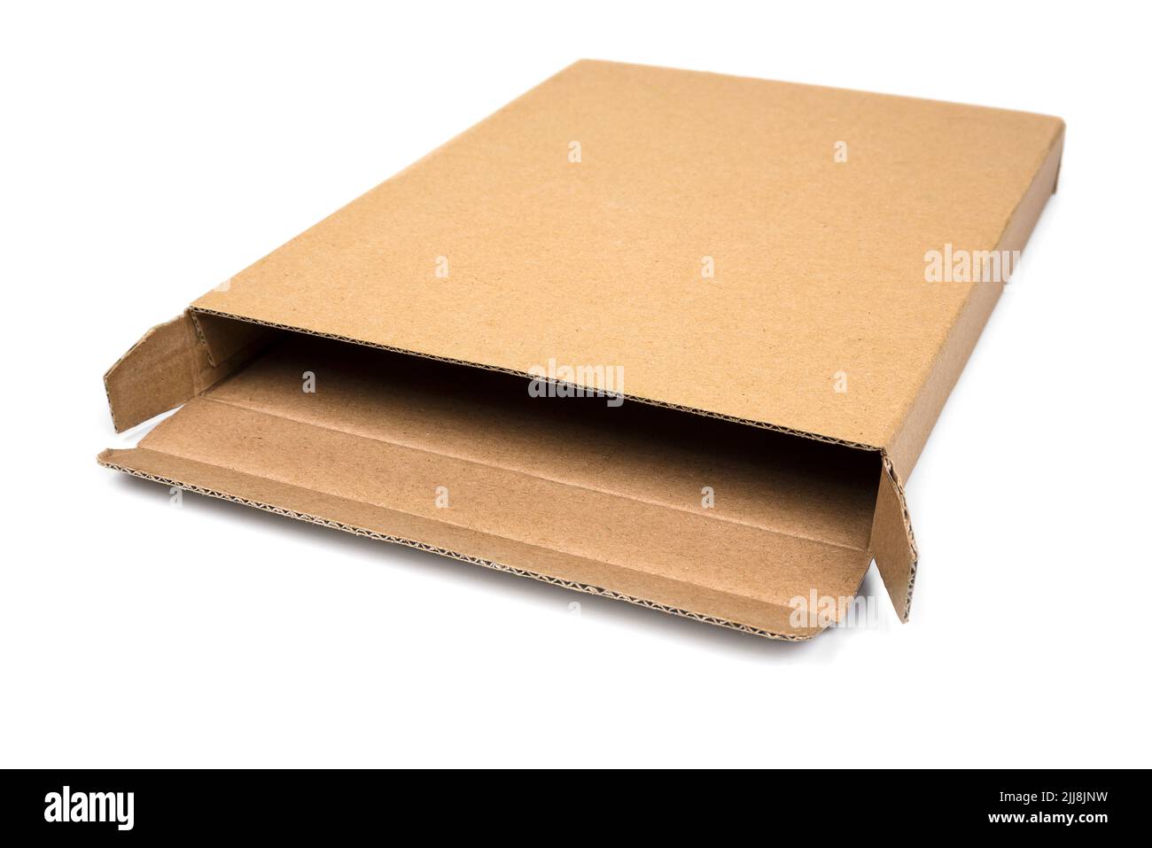 Very narrow cardboard box on a white Stock Photo