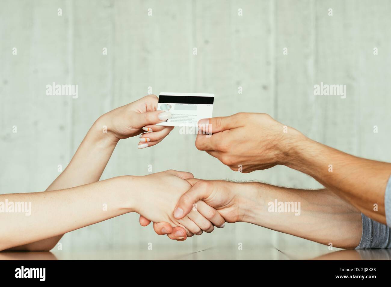 online money loan handshake deal transfer card Stock Photo