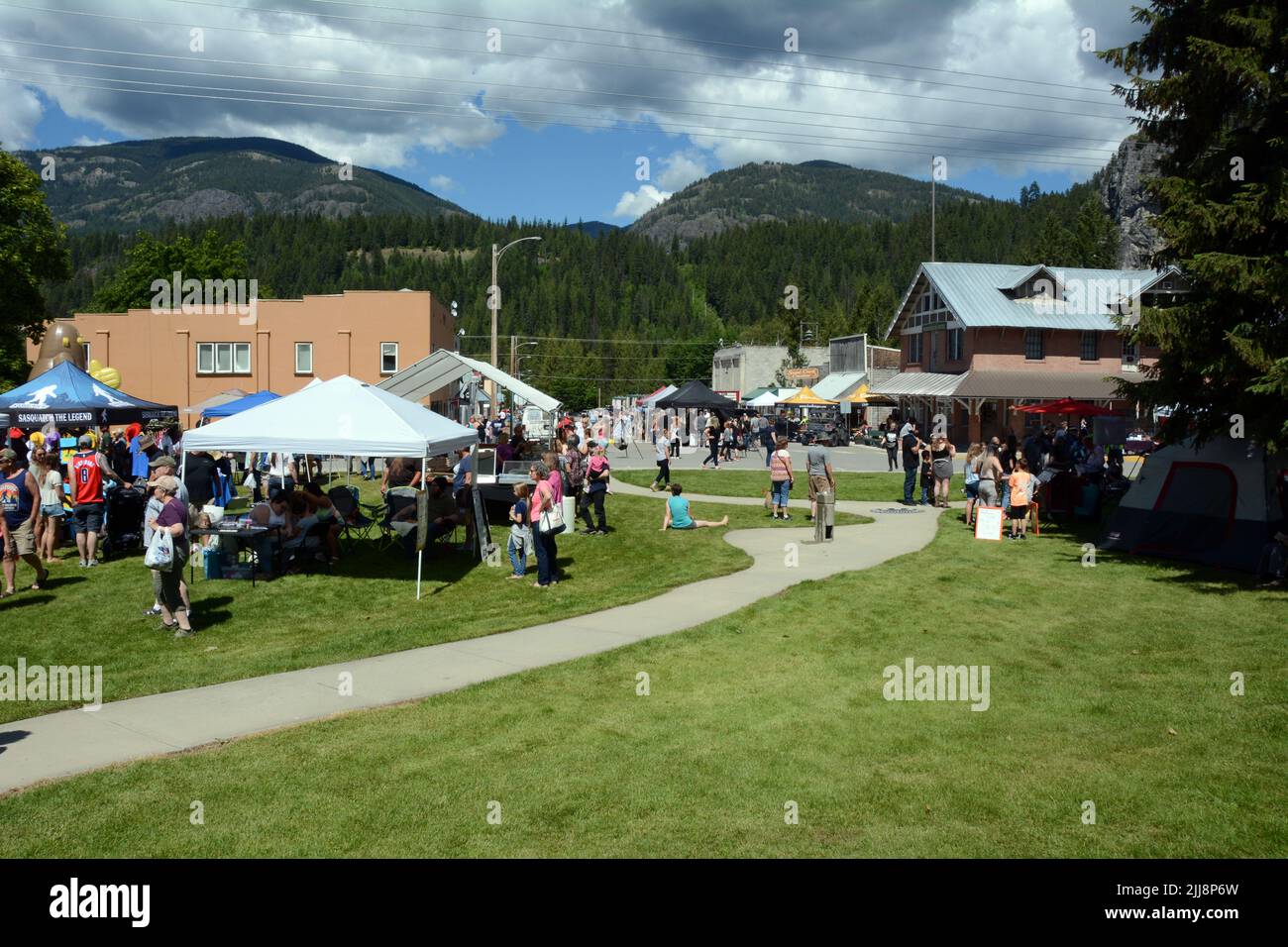 Vendors and visitors on the grounds of the Metaline Falls Bigfoot Festival in Metaline Falls, Washington State, USA. Stock Photo