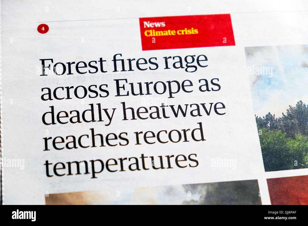 'Forest fires rage across Europe as deadly heatwave reaches record temperatures' Guardian newspaper headline cutting 20 July 2022 London UK Stock Photo