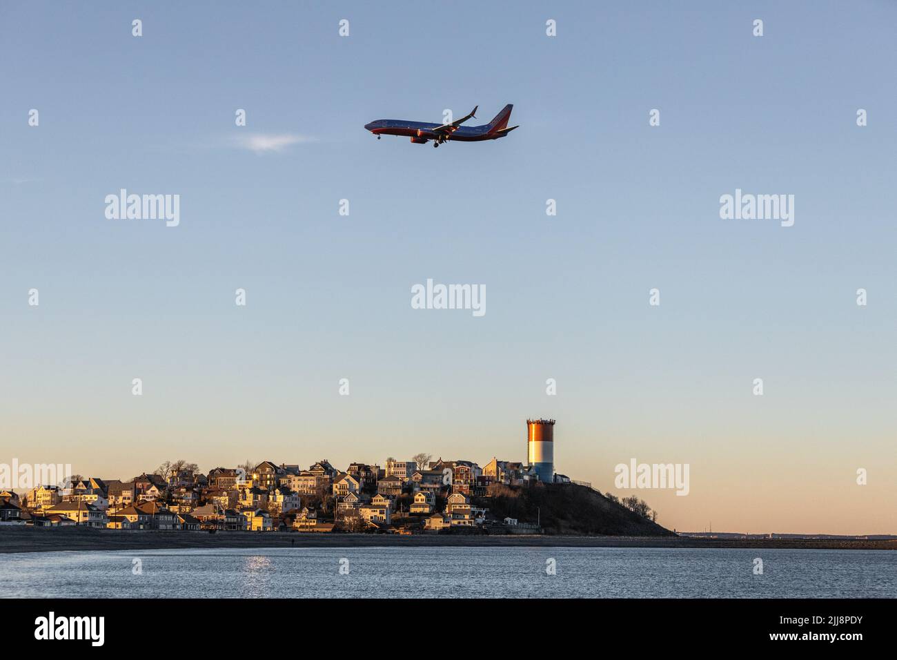 Airplane flying over high buildings hi-res stock photography and images ...