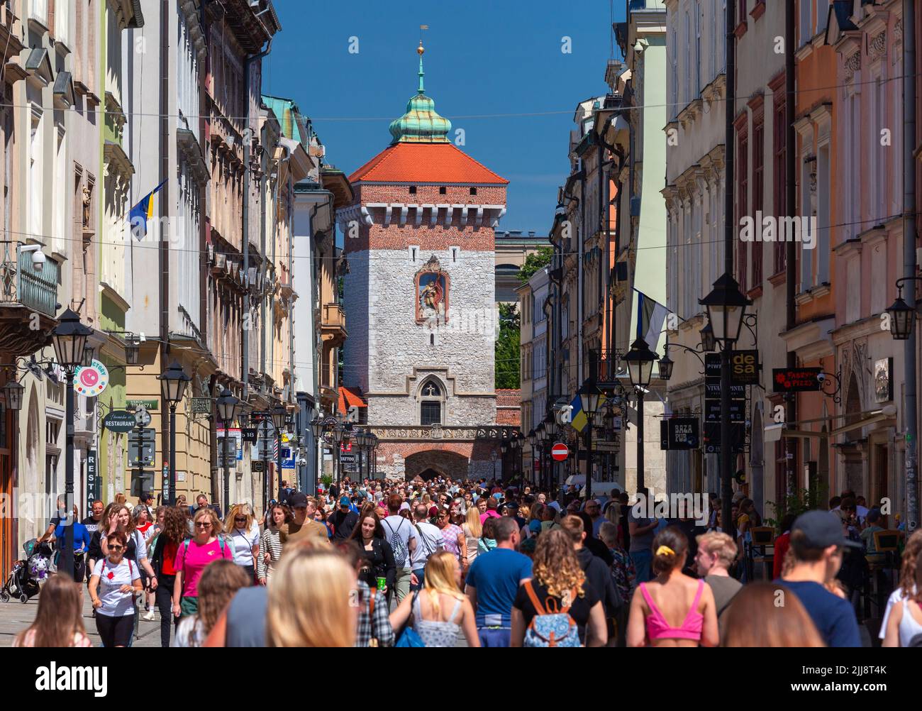 Krakow, Poland - July 18, 2022: Groups of tourists on the old city streets  on a sunny day Stock Photo - Alamy