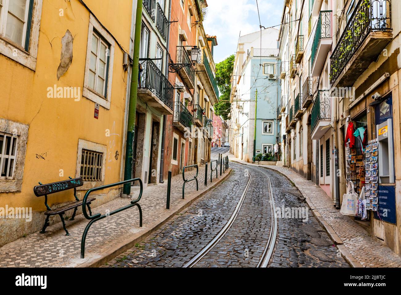 Tram line 28 runs through narrow streets of the old town of Lisbon and is an attraction for tourists, Portugal Stock Photo