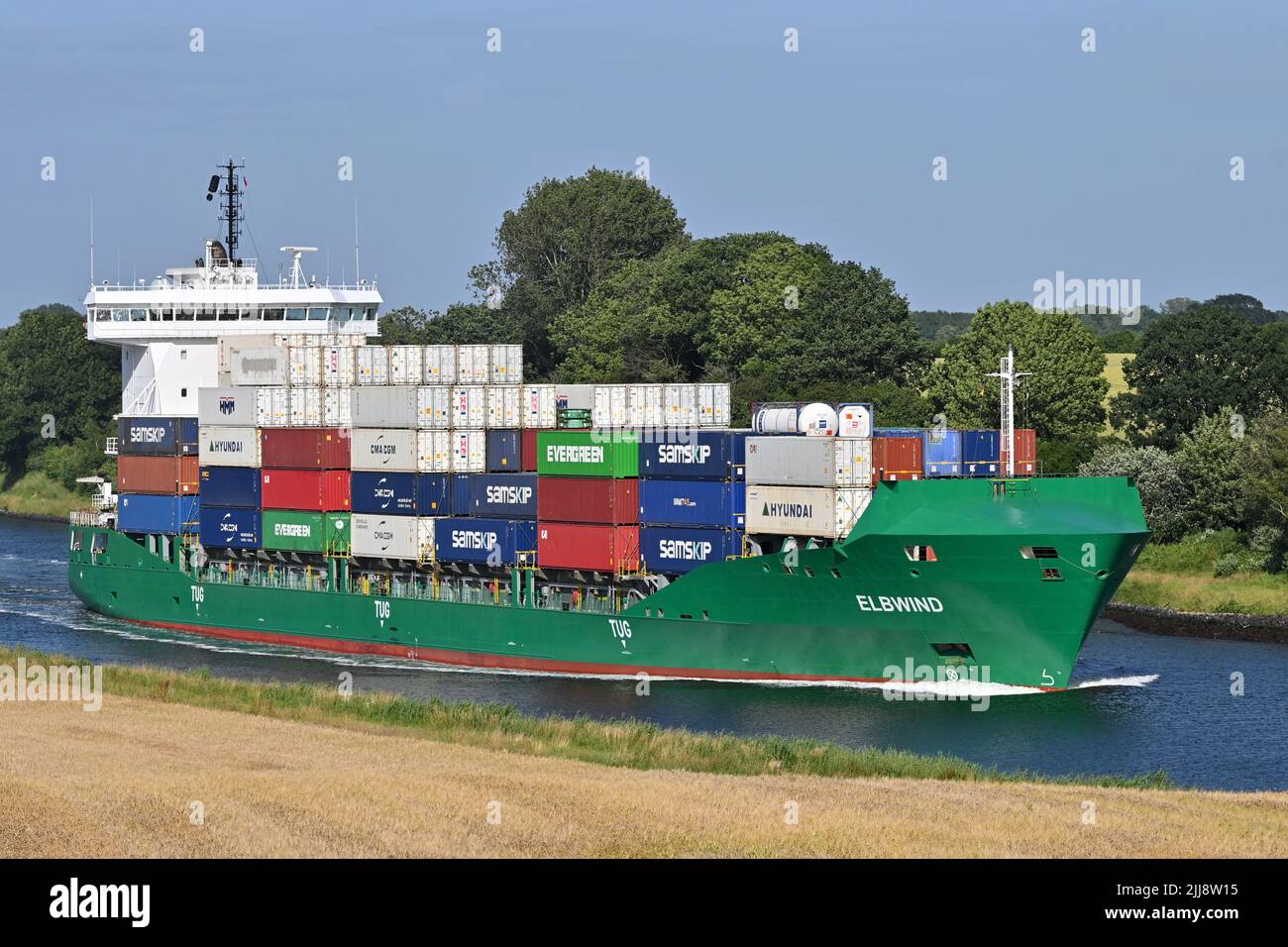 Containership ELBWIND passing the Kiel Canal Stock Photo