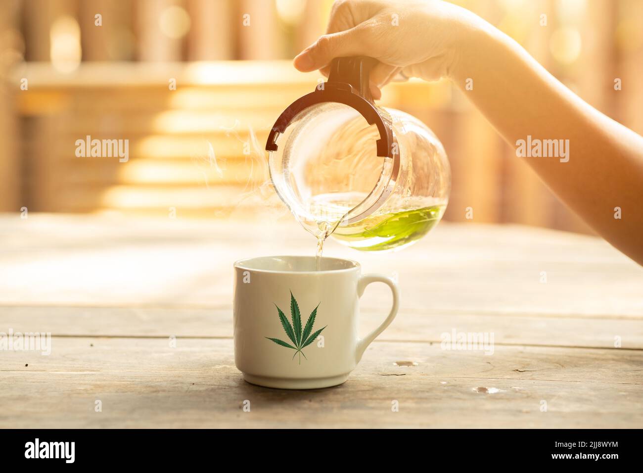cannabis sativa hemp leaf hot tea herbal CBD healthy drink for relaxation Stock Photo