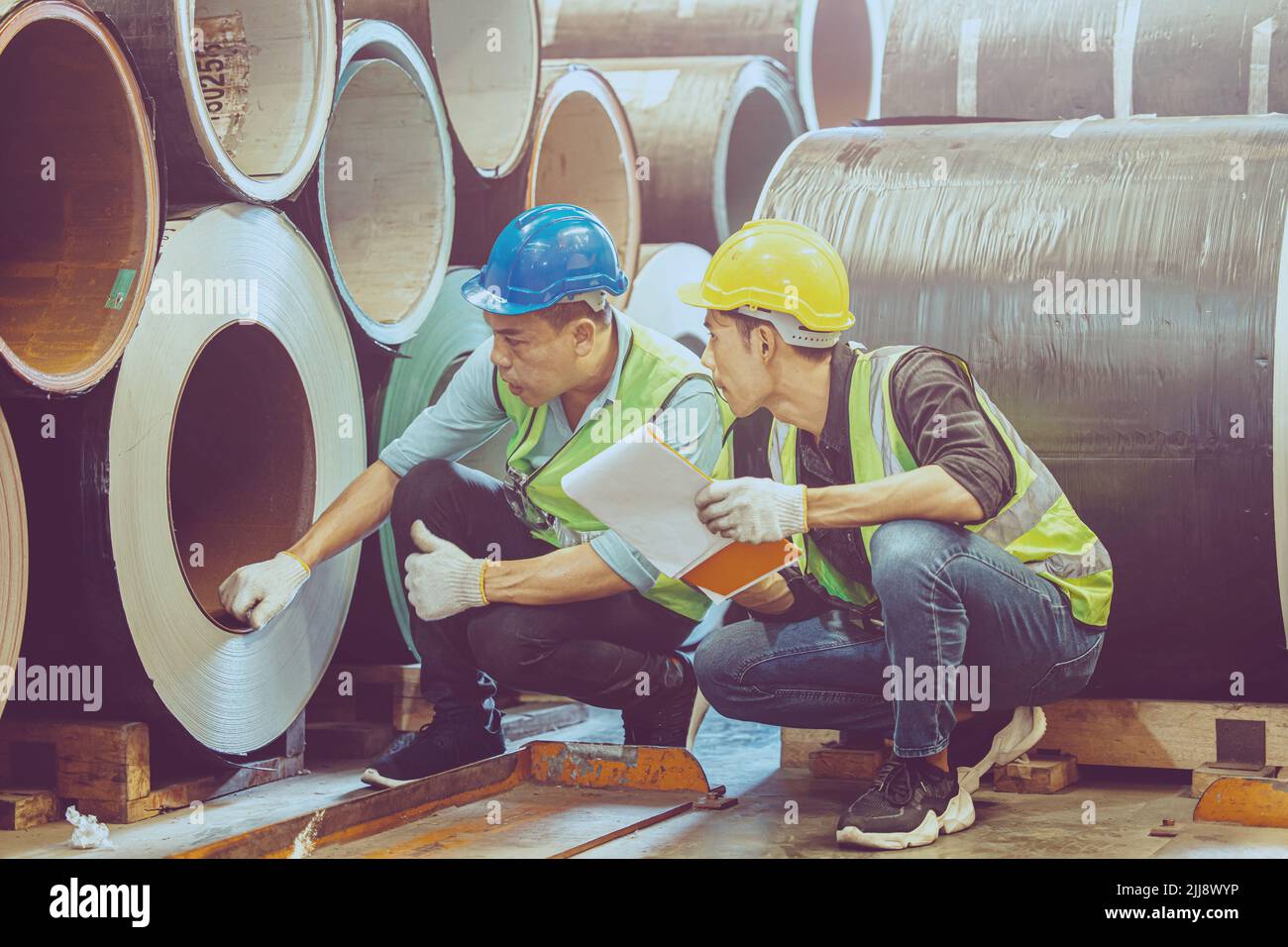 Heavy Industry Worker workman service team working in metal factory. Stock Photo