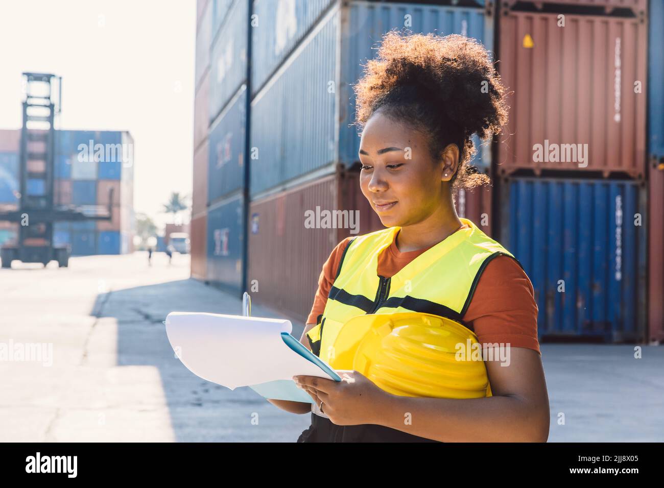 customs officer working check on list board cargo container in port yard before shipping. Stock Photo