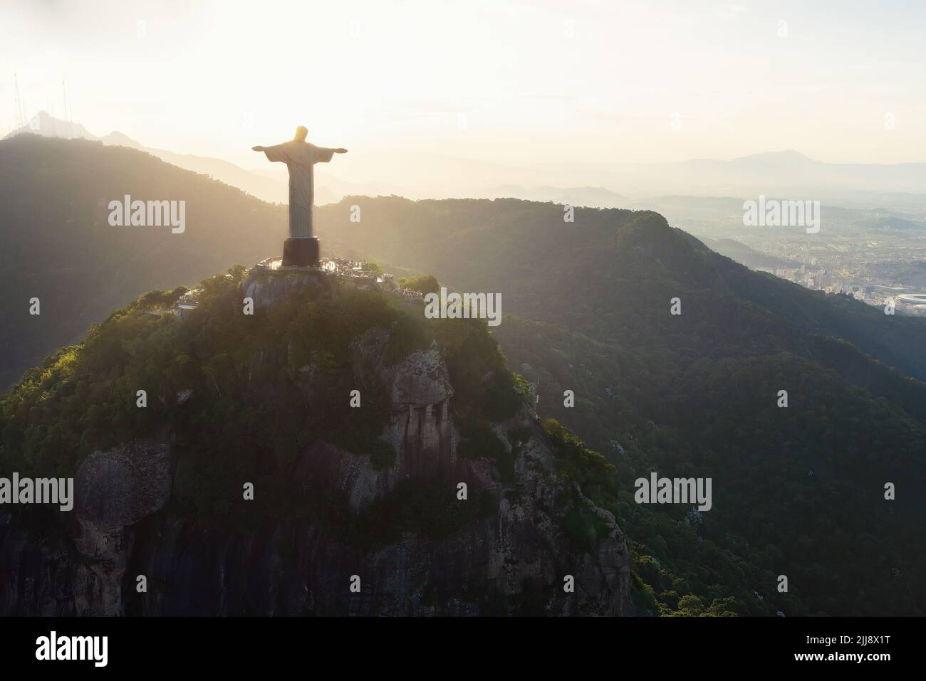 Christ the Redeemer Statue on top of Corcovado Mountain at sunset - Rio de Janeiro, Brazil Stock Photo