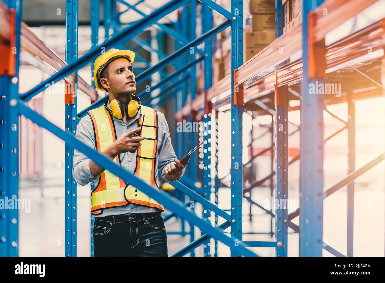 engineer male checking steel metal construction warehouse shelves structure building Stock Photo