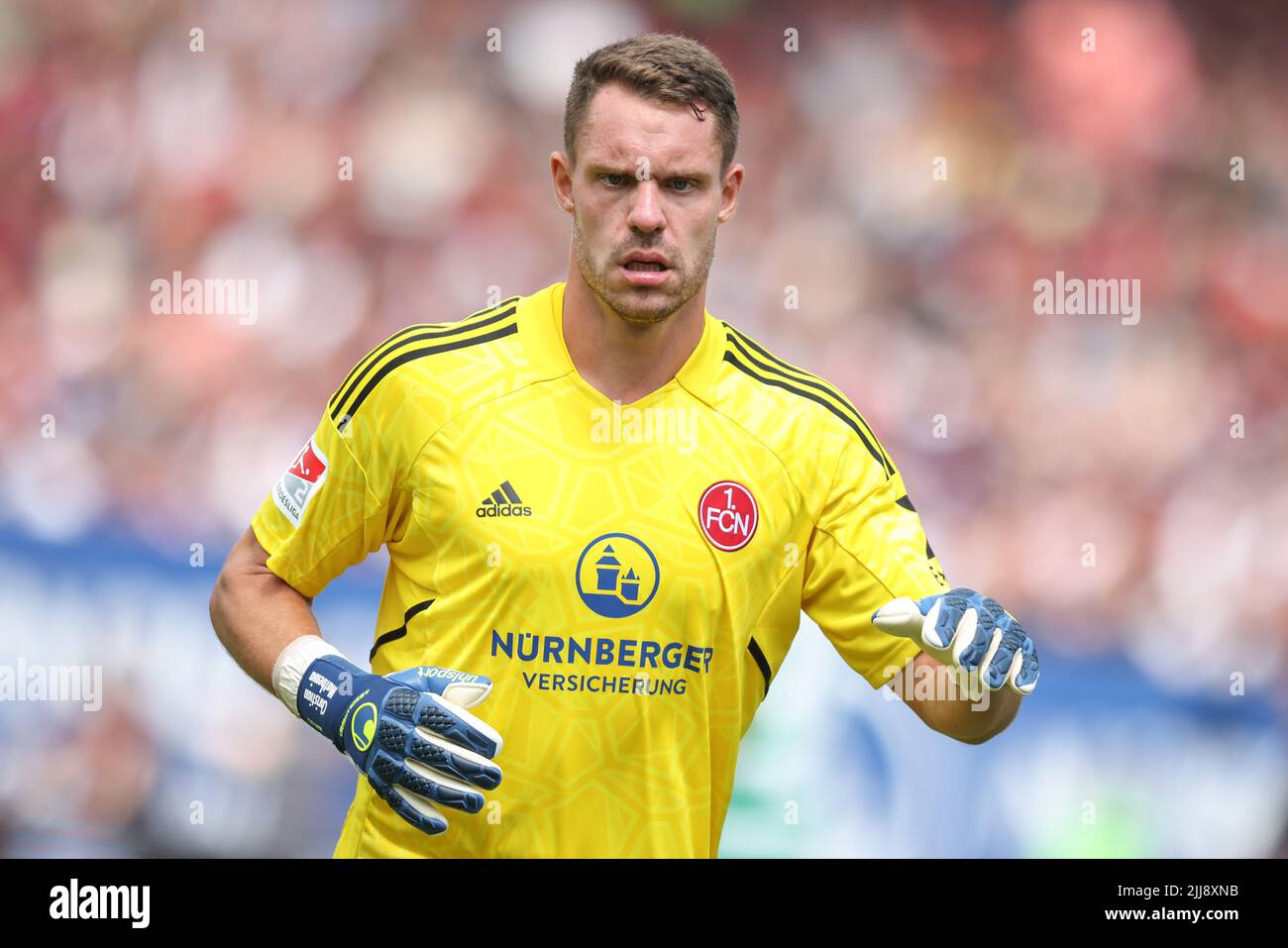 Nuremberg, Germany. 23rd July, 2022. Soccer: 2nd Bundesliga, 1. FC Nuremberg - SpVgg Greuther Fürth, 2nd matchday at Max Morlock Stadium. Nuremberg goalkeeper Christian Mathenia. Credit: Daniel Karmann/dpa - IMPORTANT NOTE: In accordance with the requirements of the DFL Deutsche Fußball Liga and the DFB Deutscher Fußball-Bund, it is prohibited to use or have used photographs taken in the stadium and/or of the match in the form of sequence pictures and/or video-like photo series./dpa/Alamy Live News Stock Photo