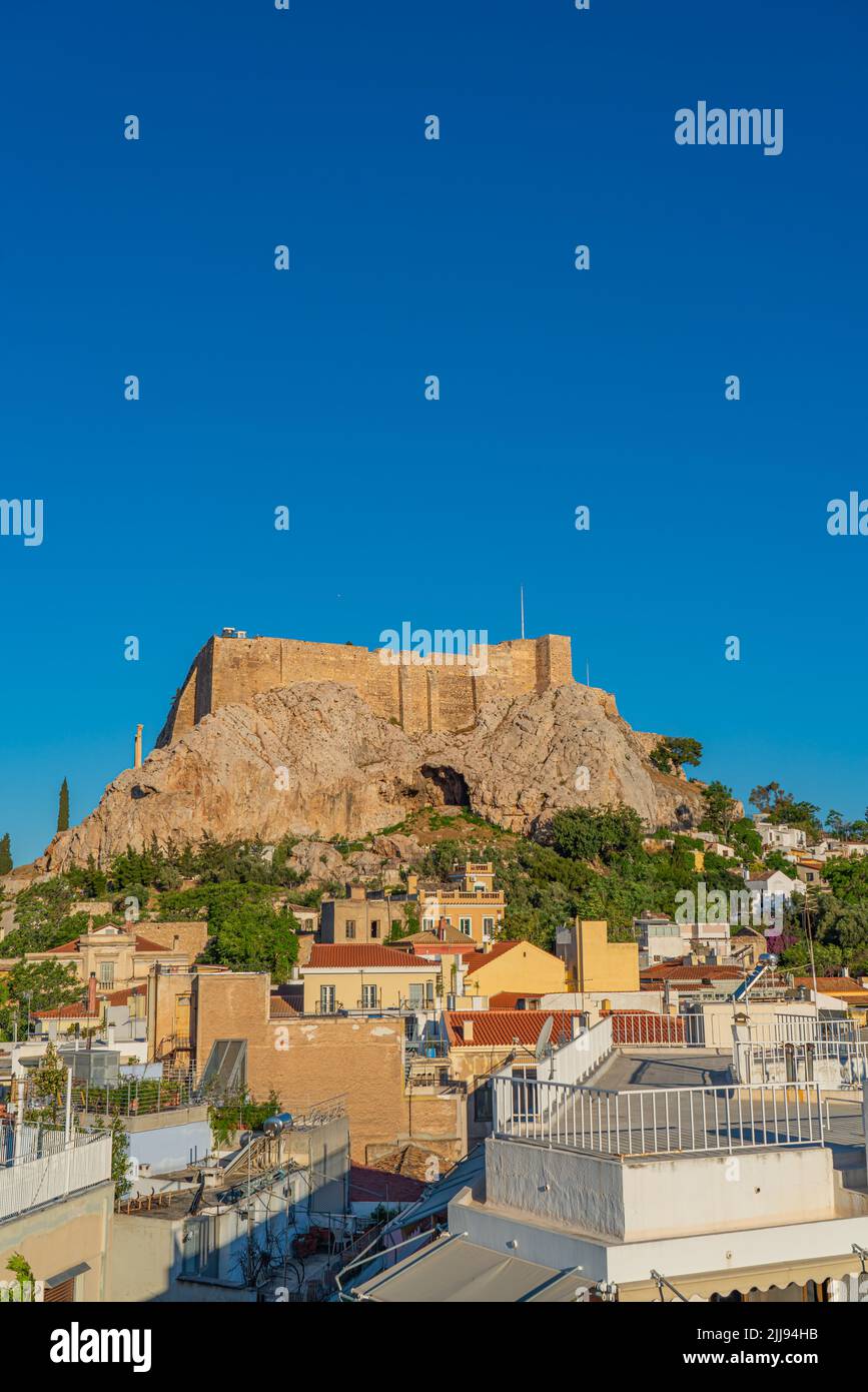 ATHENS, GREECE - MAY 21, 2022: Famous Athens landmark Acropolis with a view over the city Stock Photo