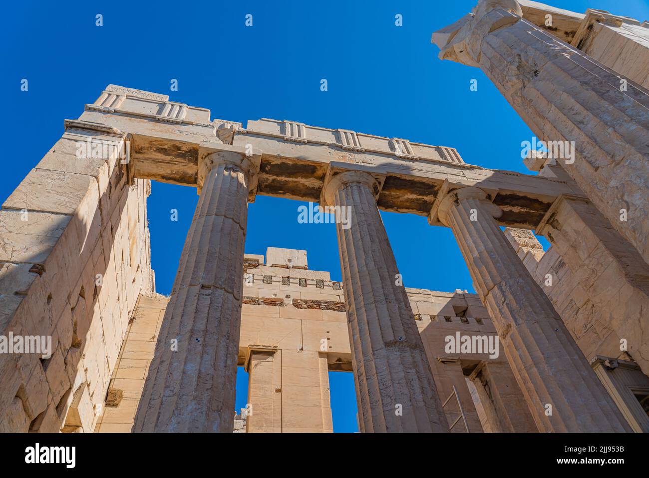 Columns of Athena Nike temple on Acropolis, landmark of Athens. Scenic view of classical building on famous Acropolis hill Stock Photo