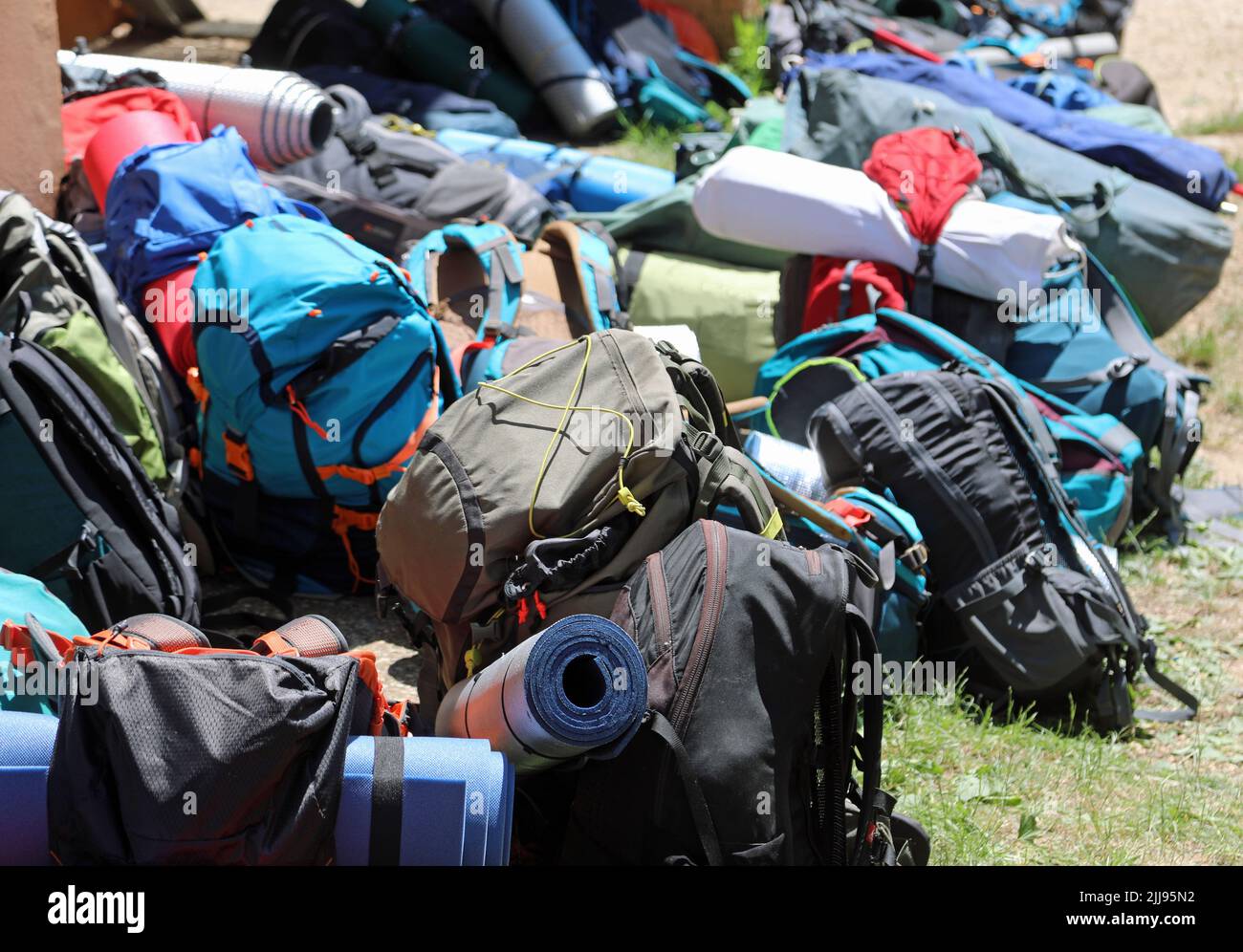 pile of many backpacks used by young travelers during traveling camping