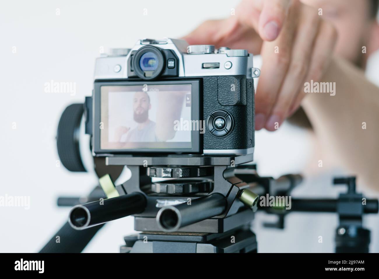 blog video streaming equipment man adjust camera Stock Photo