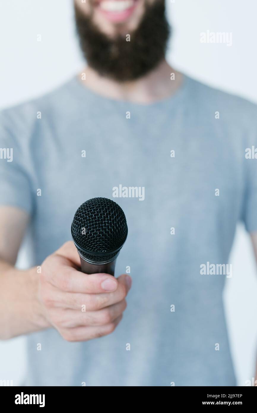 mass media journalism reporter hold mic interview Stock Photo
