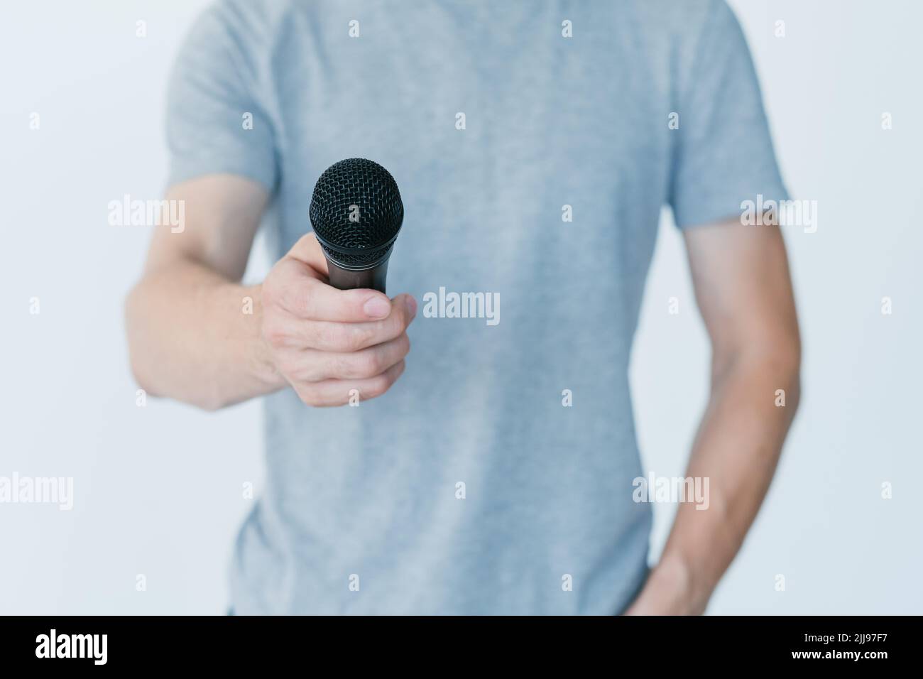 man holding microphone interview broadcaster media Stock Photo