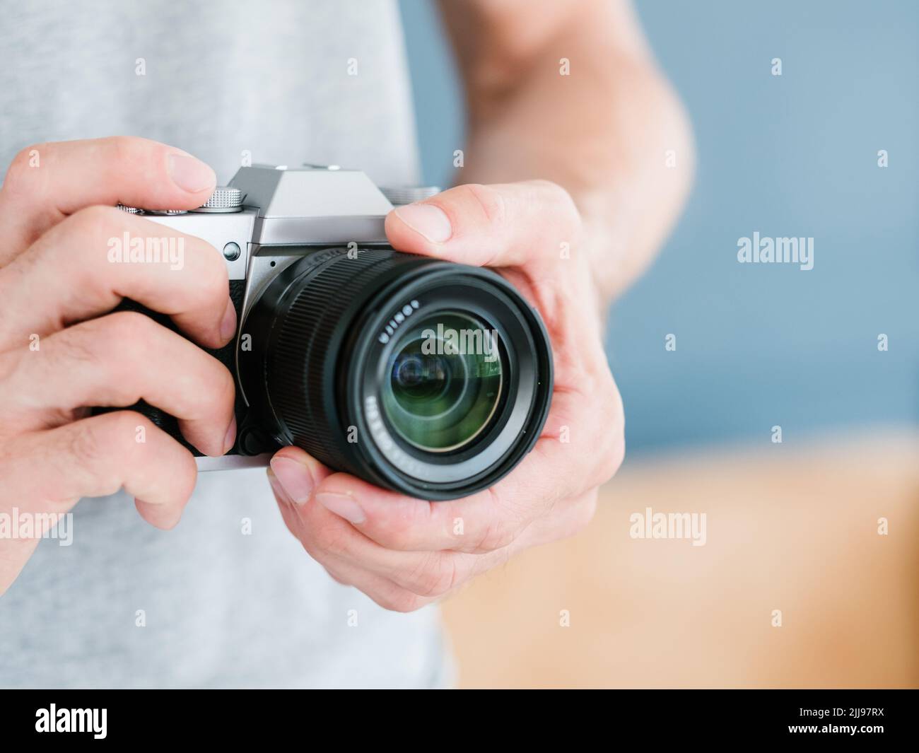 photography equipment technology man hold camera Stock Photo