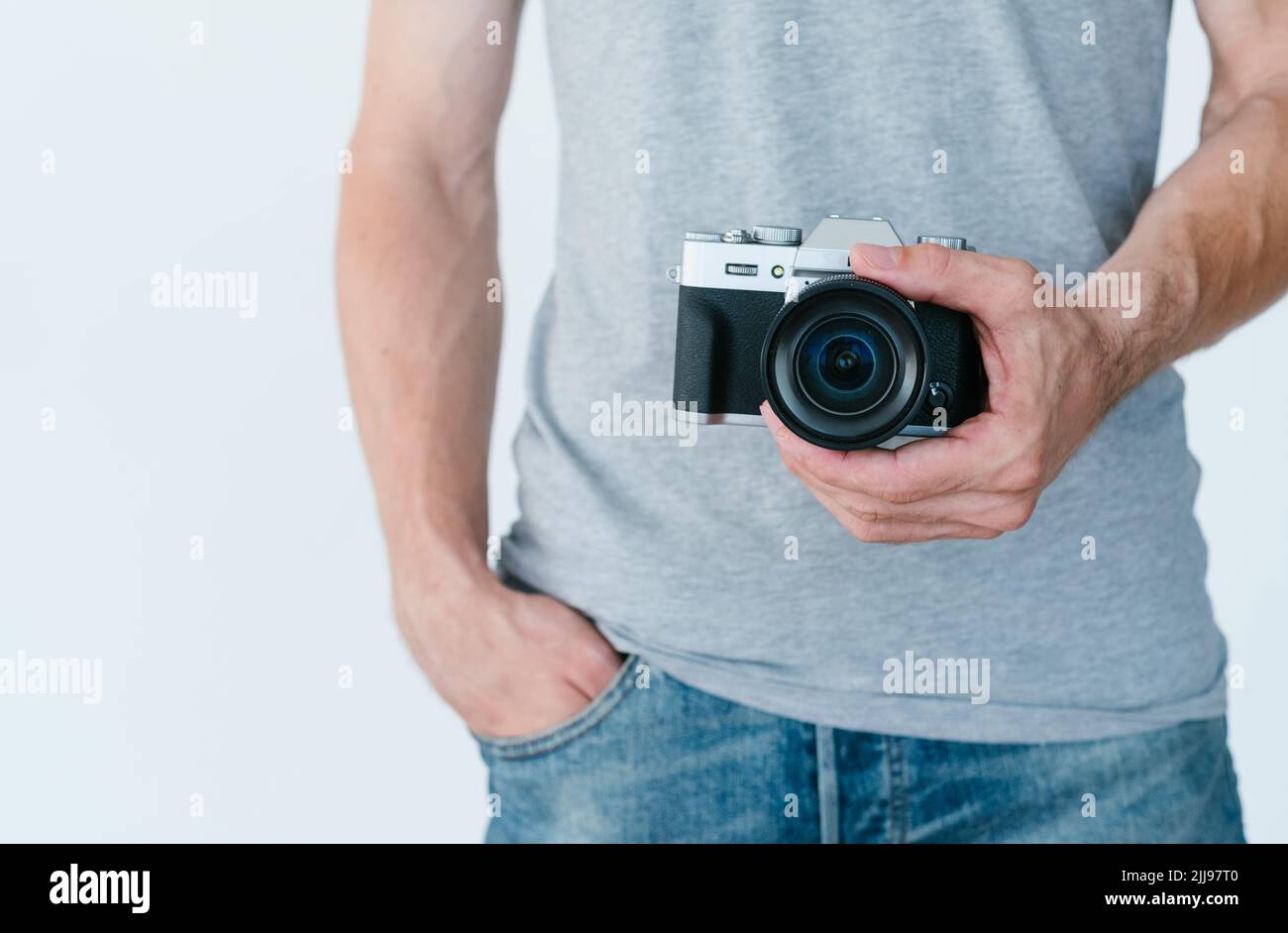 photography equipment electronics man hold camera Stock Photo