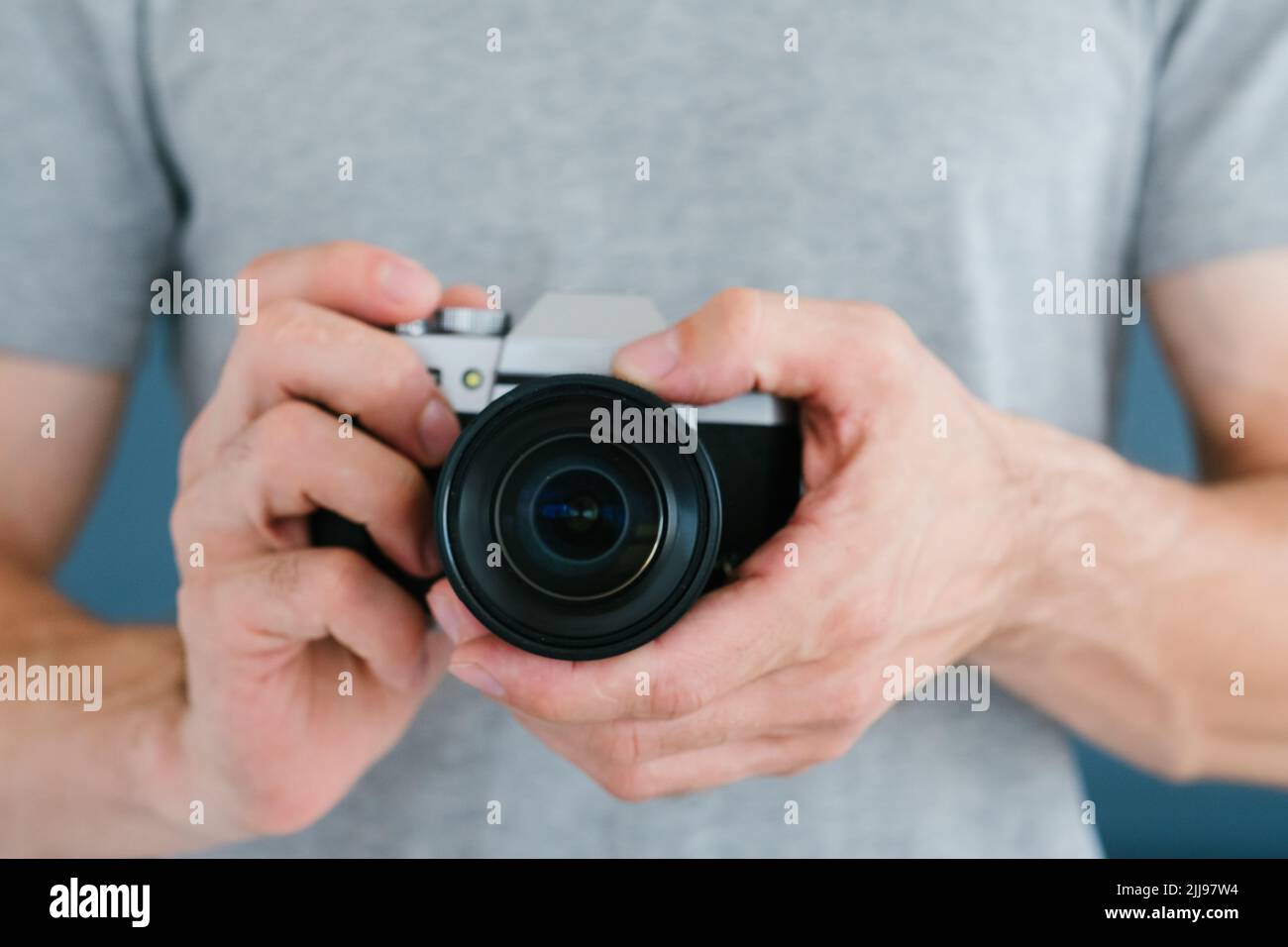 technology photo video man holding camera blogging Stock Photo