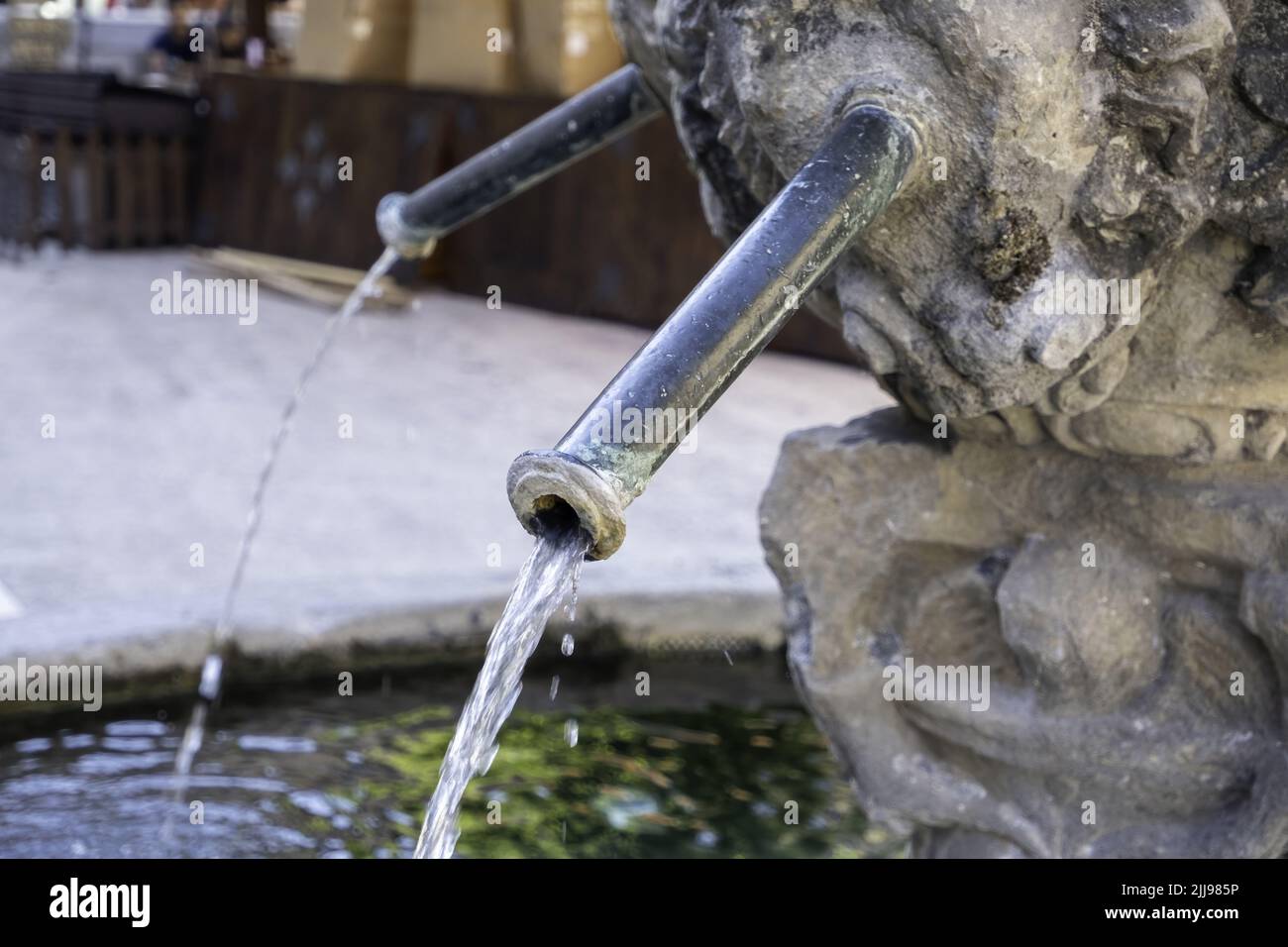 Old stone fountain in the city, decoration with water Stock Photo