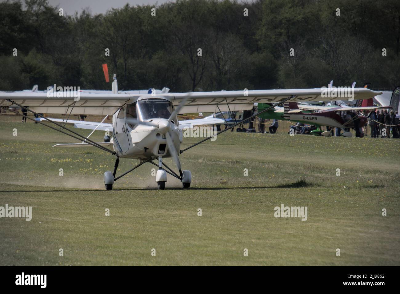 An Ikarus C42 light aircraft at Popham Airfield in Hampshire for the Microlight Trade Fair 2022 Stock Photo