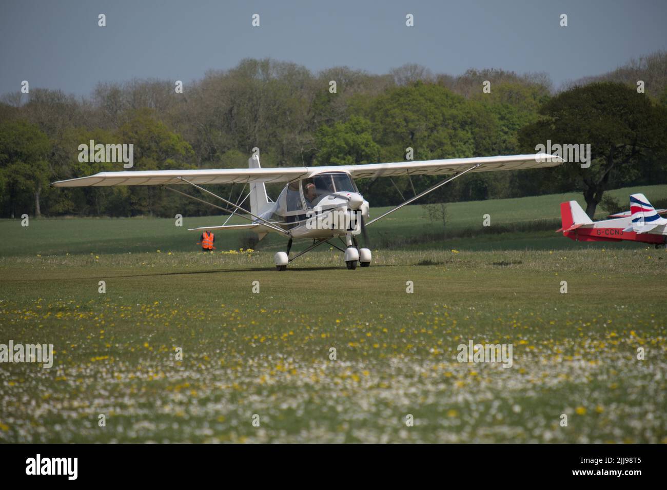 An Ikarus C42 light aircraft at Popham Airfield in Hampshire for the Microlight Trade Fair 2022 Stock Photo