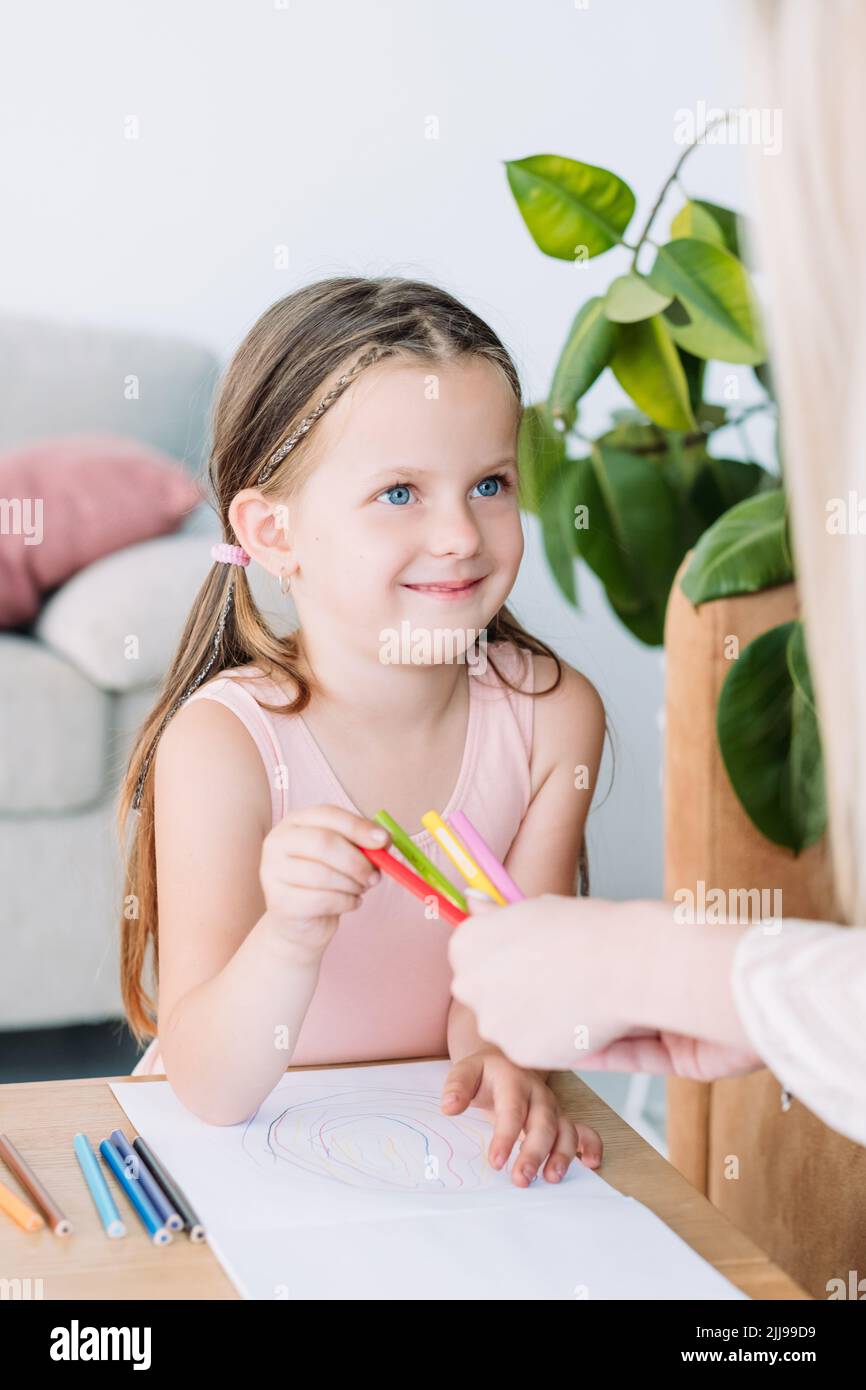 art therapy kids smiling girl pencil drawing hobby Stock Photo