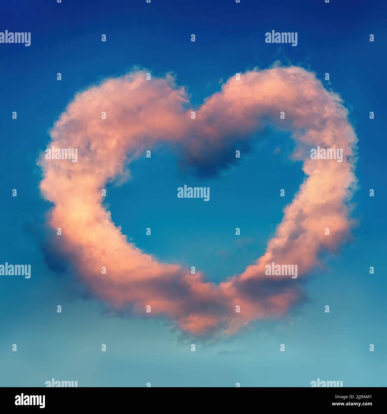3d rendering of pink heart-shaped cloud over blue sky Stock Photo