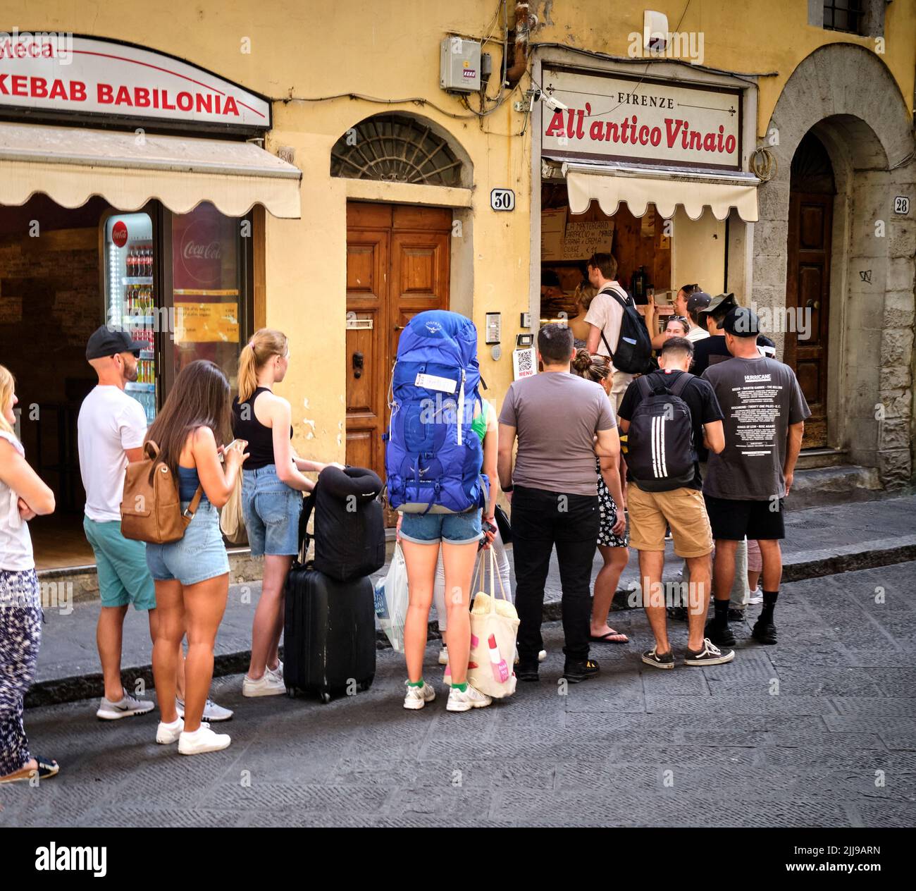 Customers queing outside All Antico Vinaio Sandwich Shop inVia dei Neri Florence Italy Stock Photo