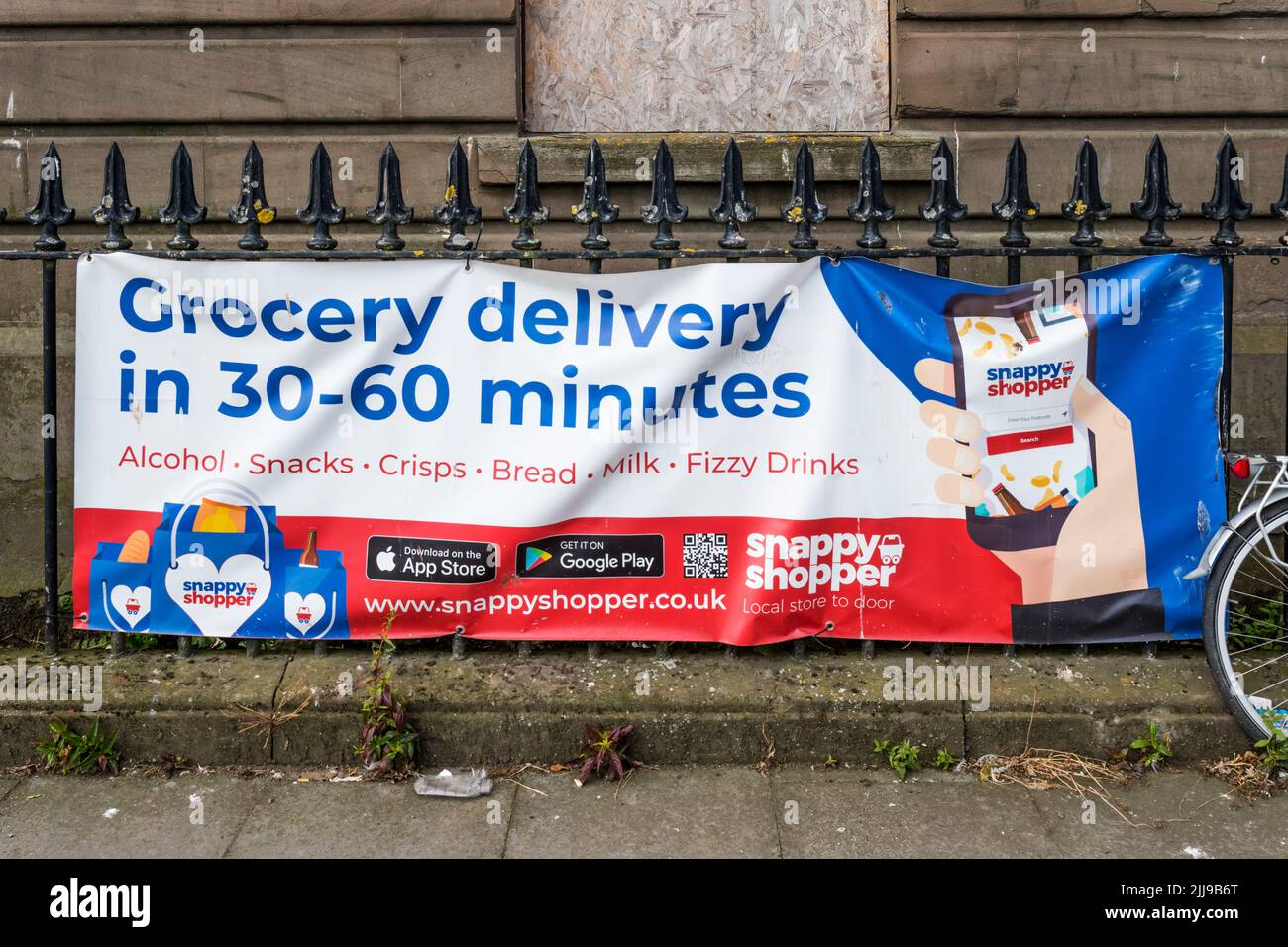 An advertisement for the Snappy Shopper grocery delivery app. Stock Photo