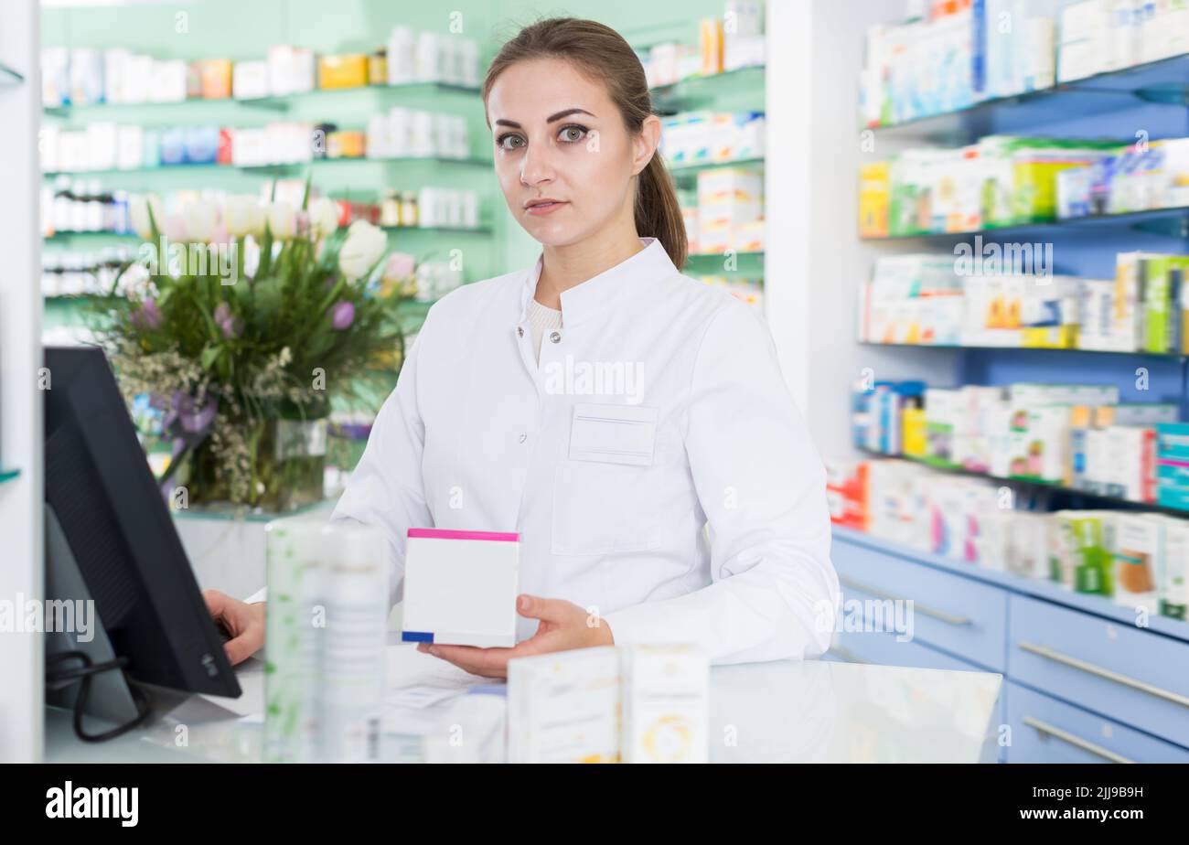 Portrait cheerful female pharmacist hi-res stock photography and images ...