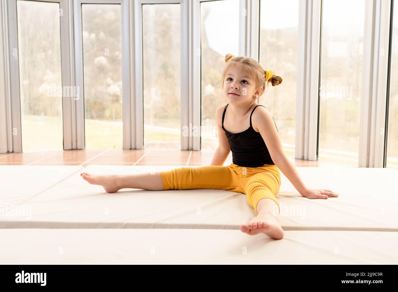 Beautiful little girl in workout clothes Stock Photo - Alamy