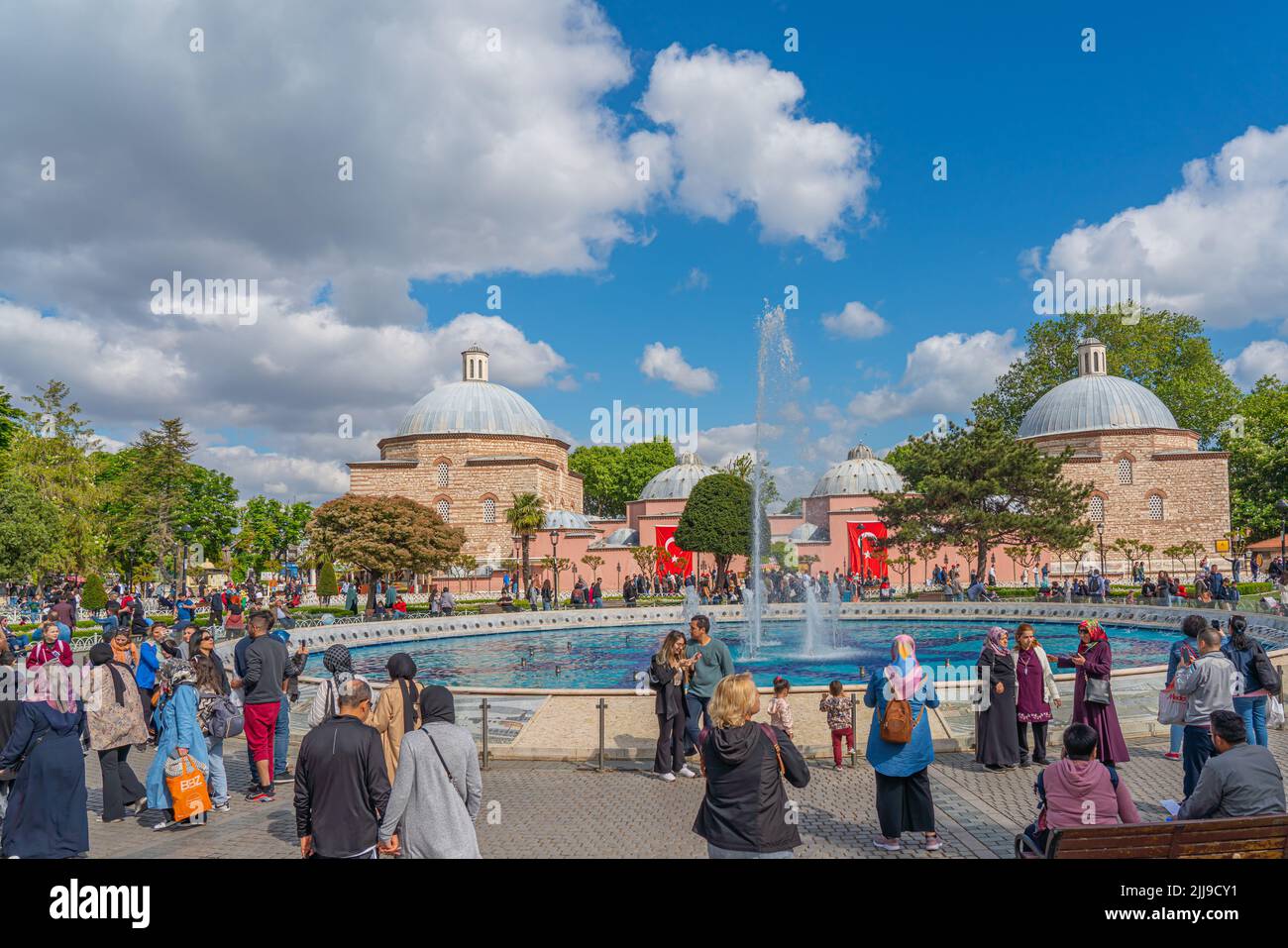 ISTANBUL, TURKEY - MAY 19.2022: People at the Sultan Ahmet park, in the background Haseki Huerrem Sultan historic building Stock Photo