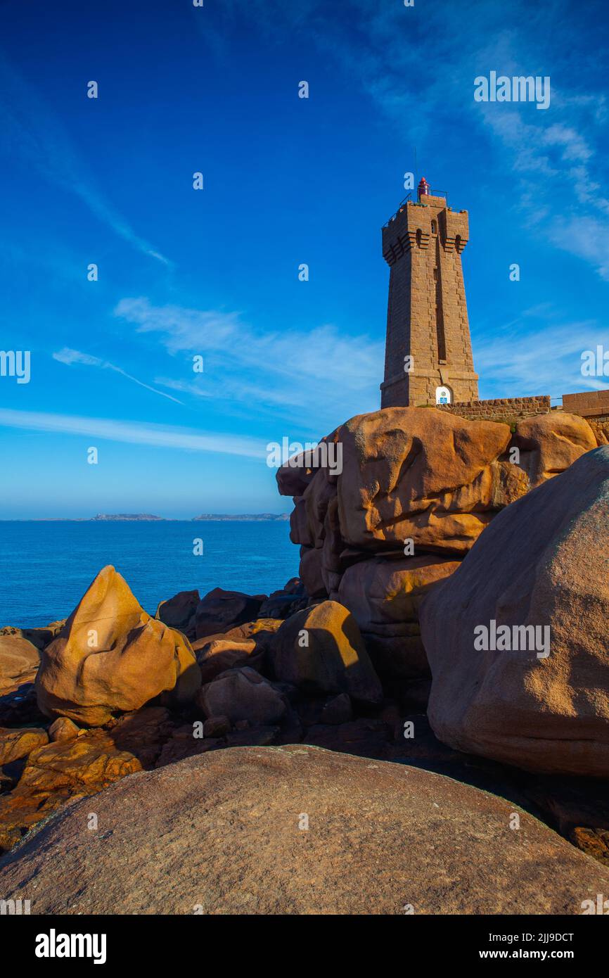 Lighthouse on the Pink Granite Coast. It is a stretch of coastline in the Cotes d Armor departement of northern Brittany, France. It stretches for mor Stock Photo