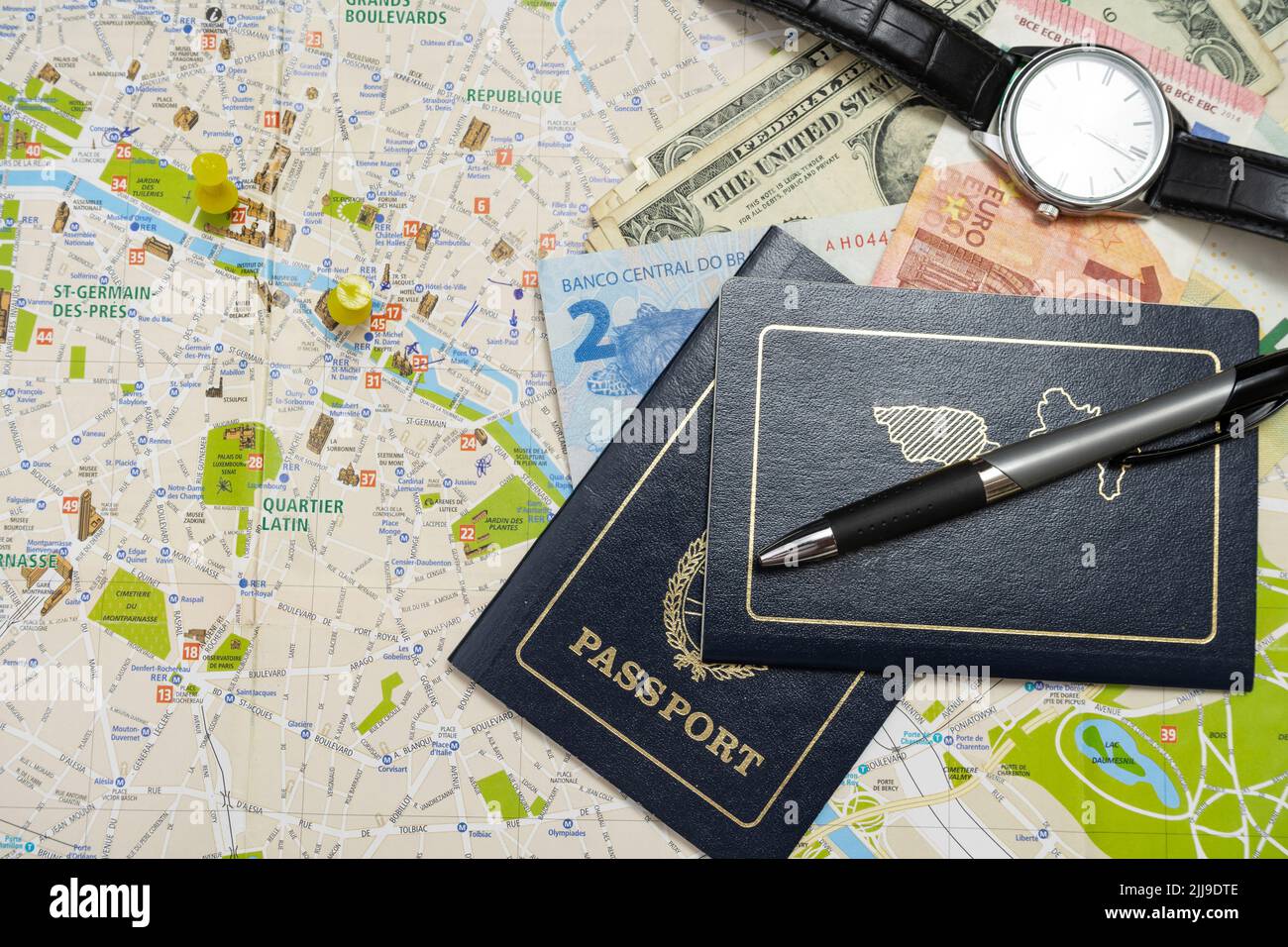 Different passports and different money on a map planning a vacation. Vacation concept, hollidays, travel. Copy space Stock Photo