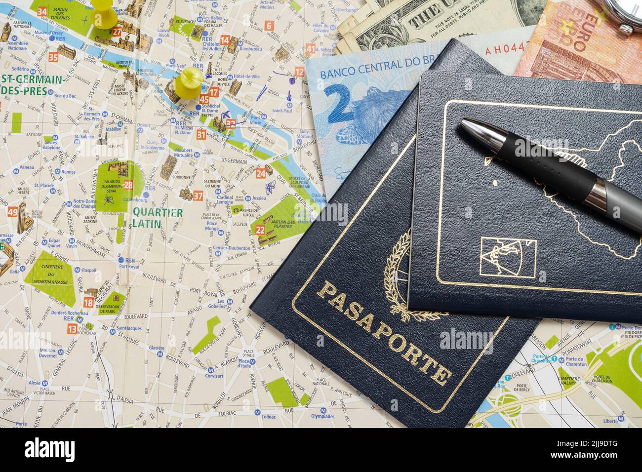 Argentine passports and different money on a map planning a vacation. Vacation concept, hollidays, travel. Copy space Stock Photo