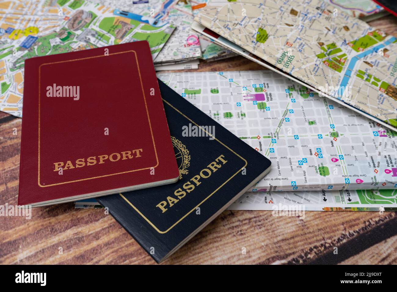 Passports on some maps planning vacations. Vacation concept, hollidays, travel. Copy space Stock Photo