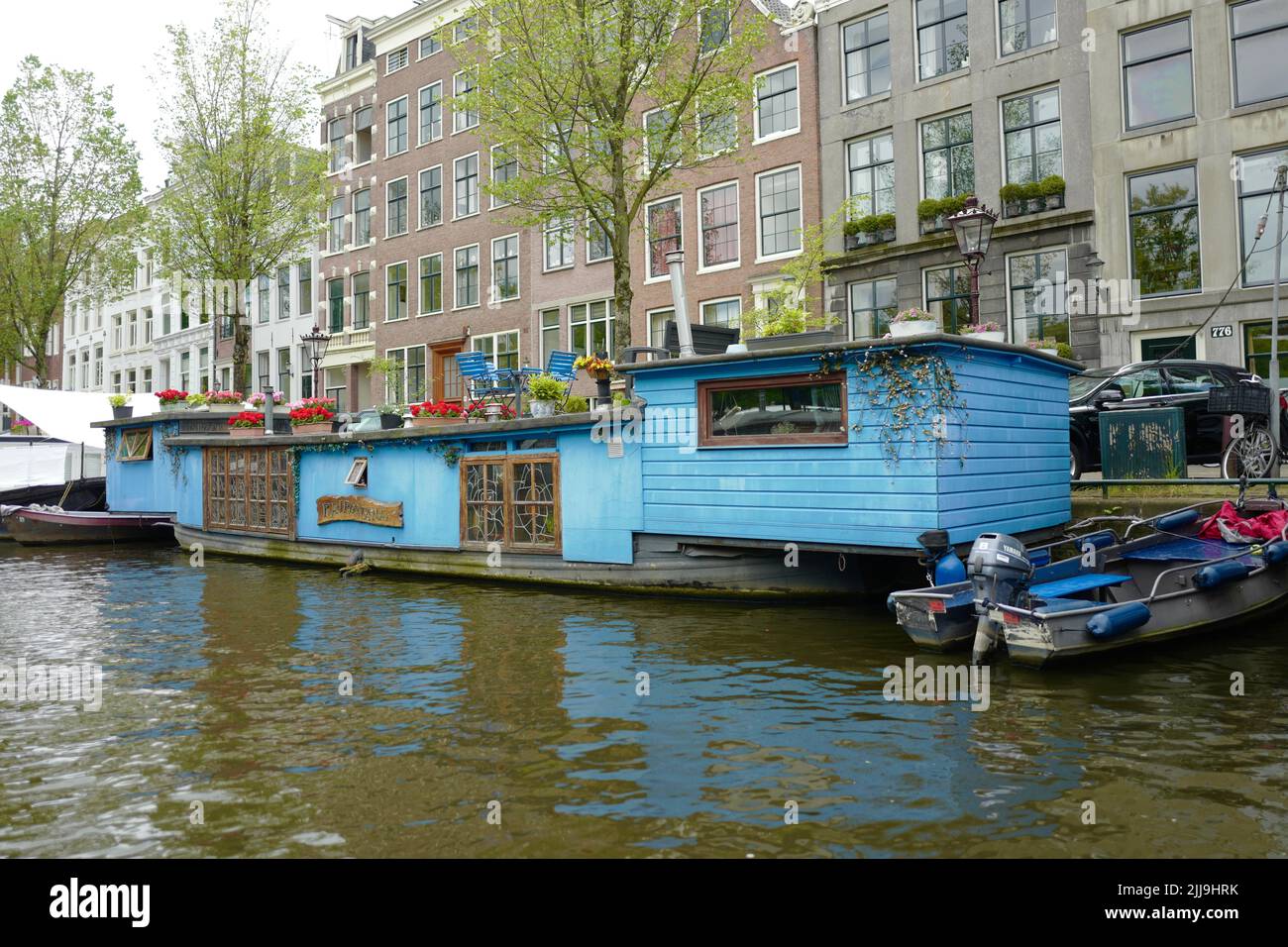 Colorfull barge on Prinsengracht in Amsterdam Stock Photo