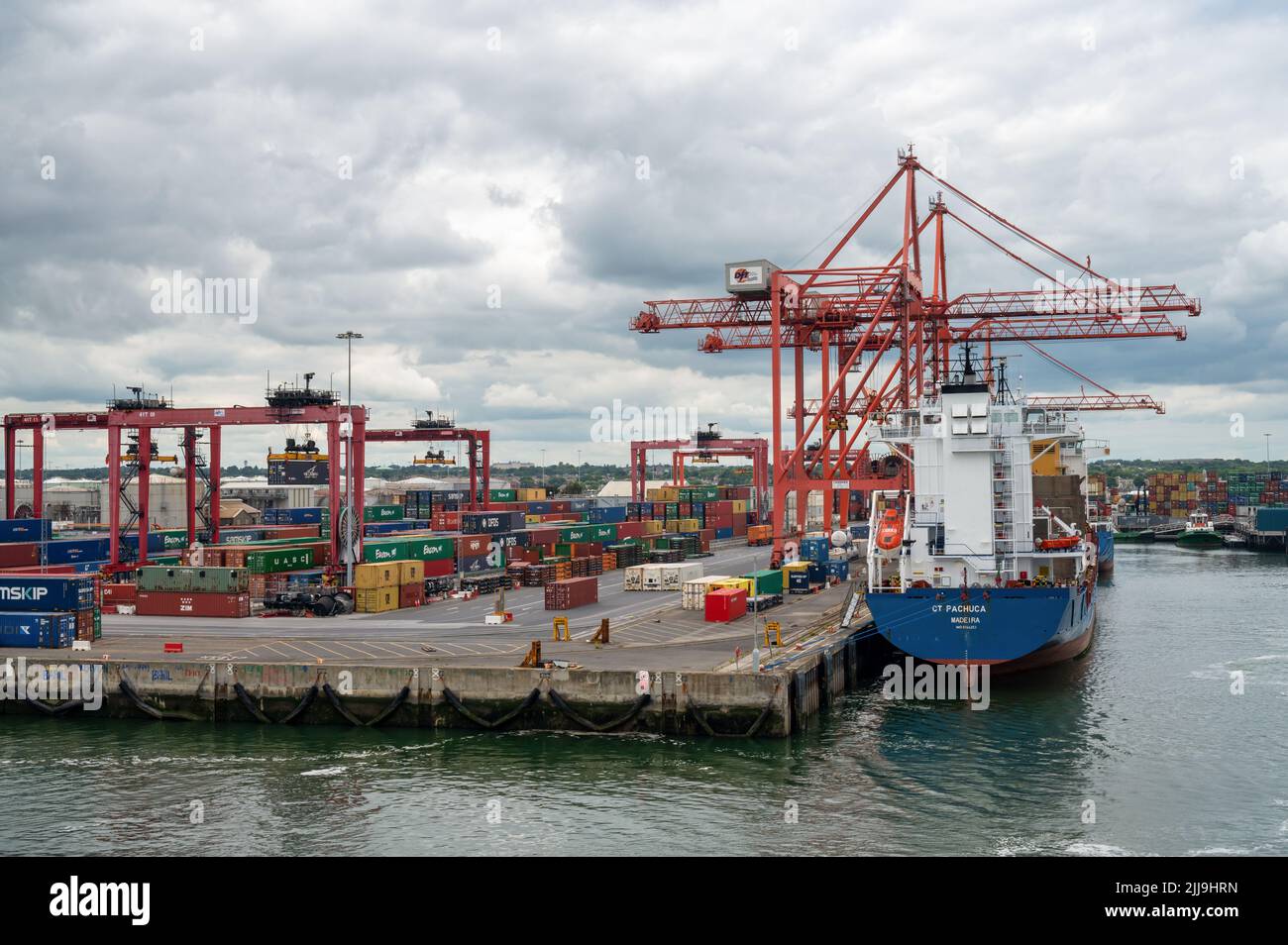 Dublin, Ireland- July 7, 2022: A container ship getting unloaded in Dublin Port Stock Photo