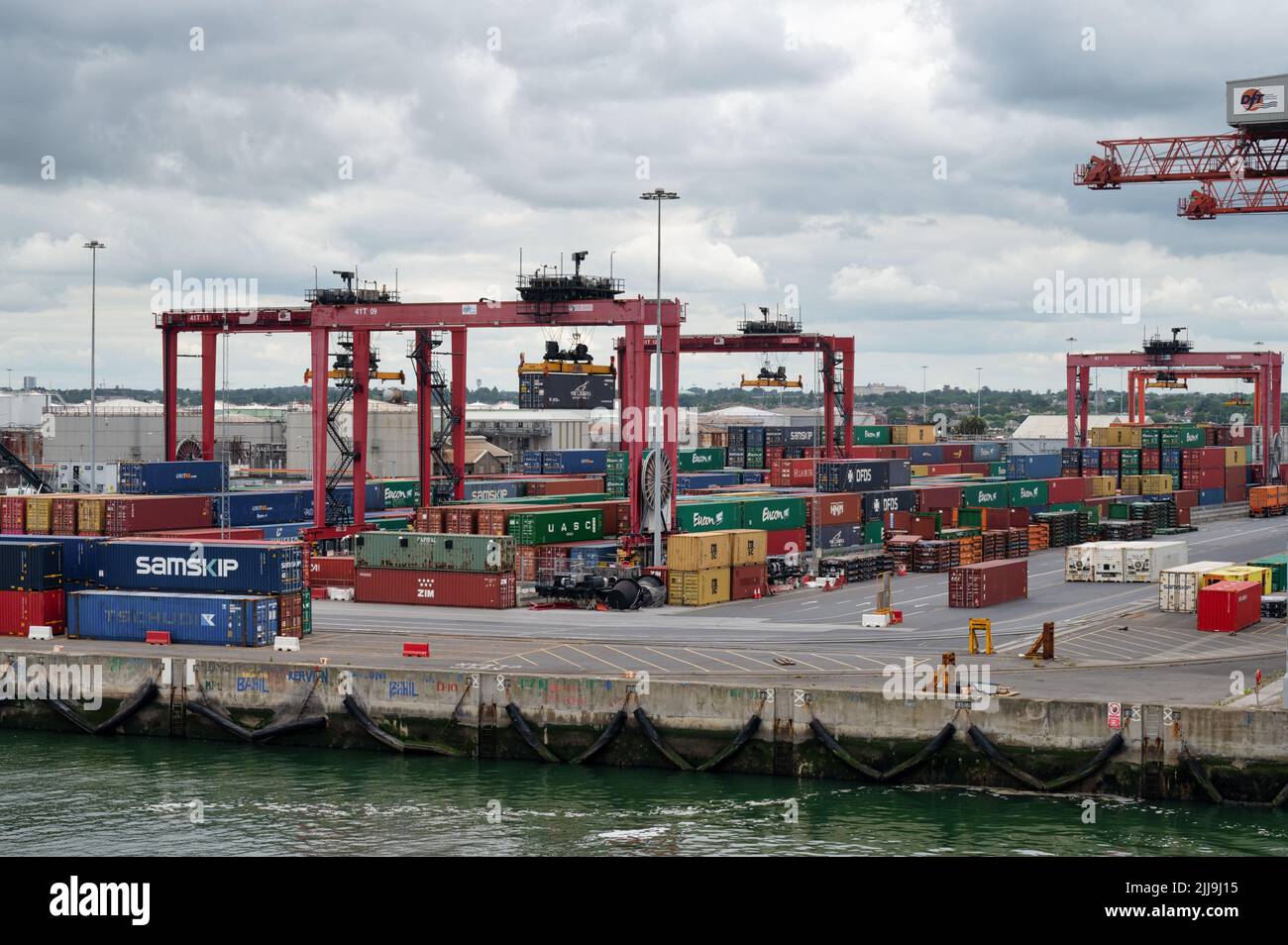 Dublin, Ireland- July 7, 2022: Shipping containers and cranes in Dublin Port Stock Photo