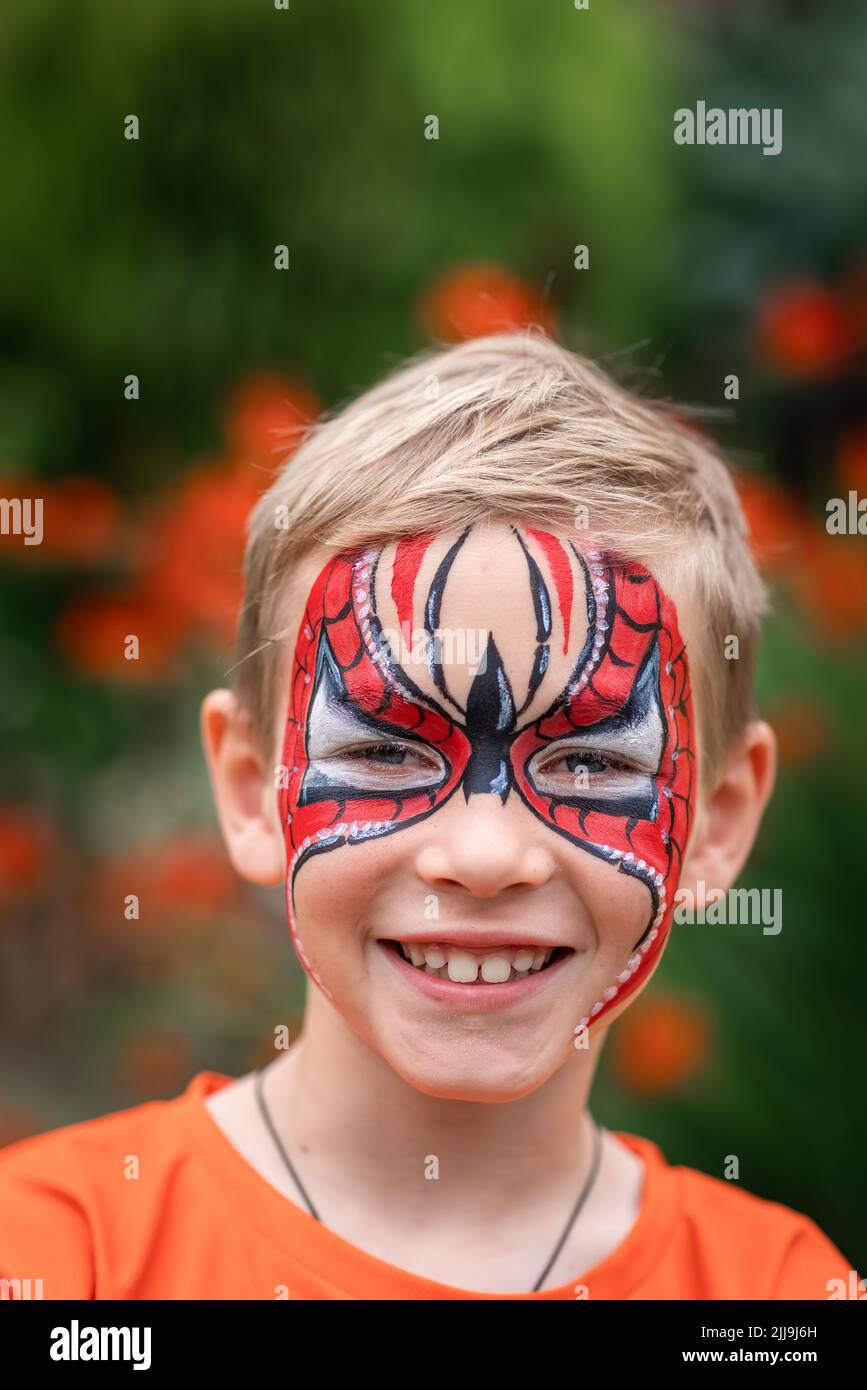 cute-little-boy-with-face-paint-face-painting-kid-painting-face-at