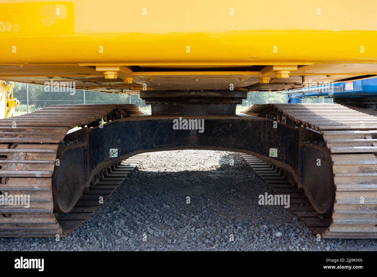 Tracks of an excavator with in the middle the slew ring, swing gear and swing bearing Stock