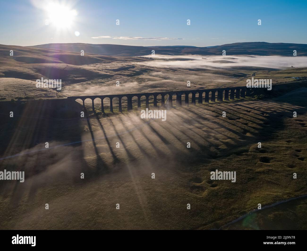 Drone view of the Iconic landmark Ribblehead Viaduct shrouded in early ...