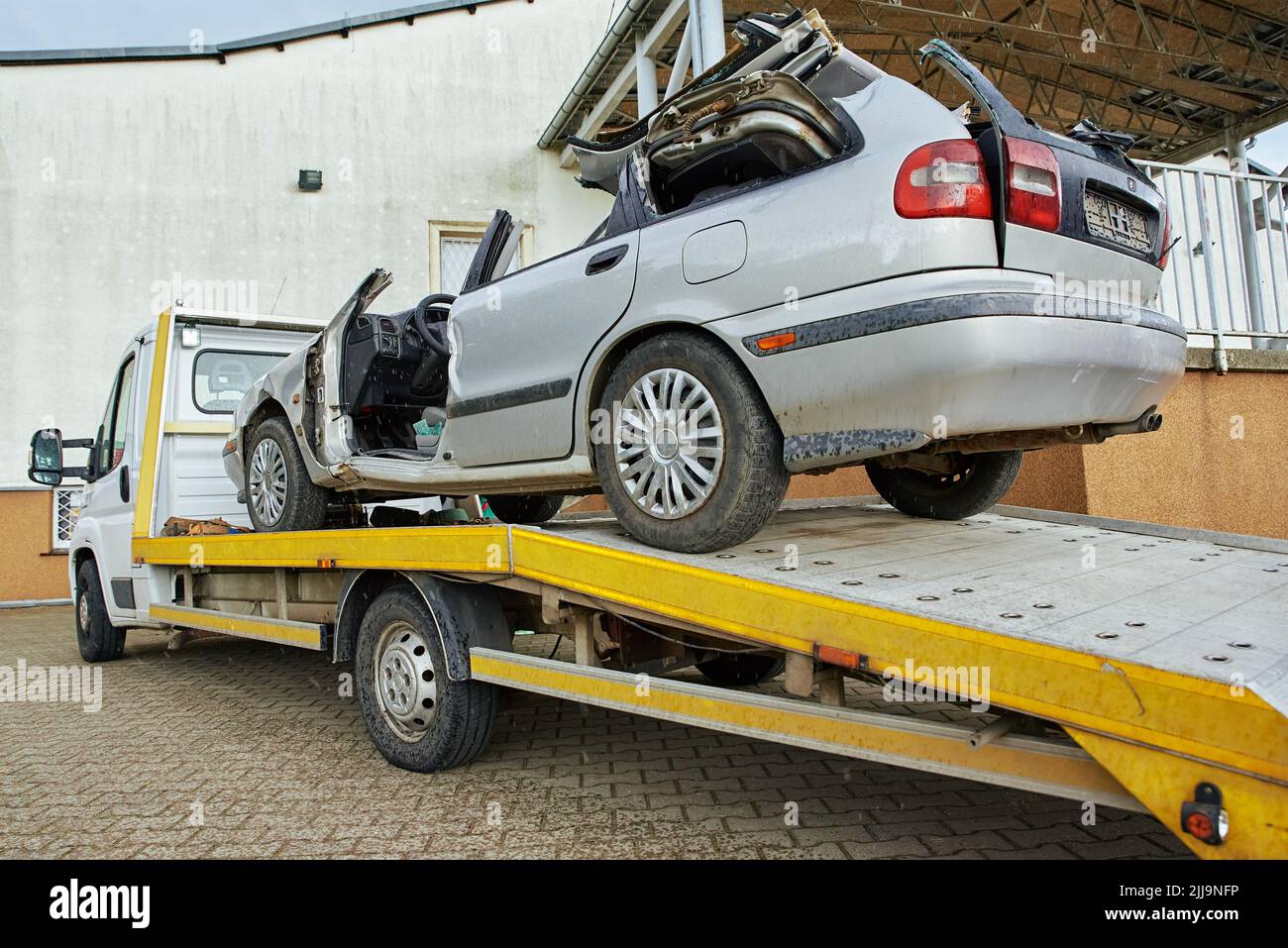 Wrecked car loading on tow truck after crash traffic accident, Concept