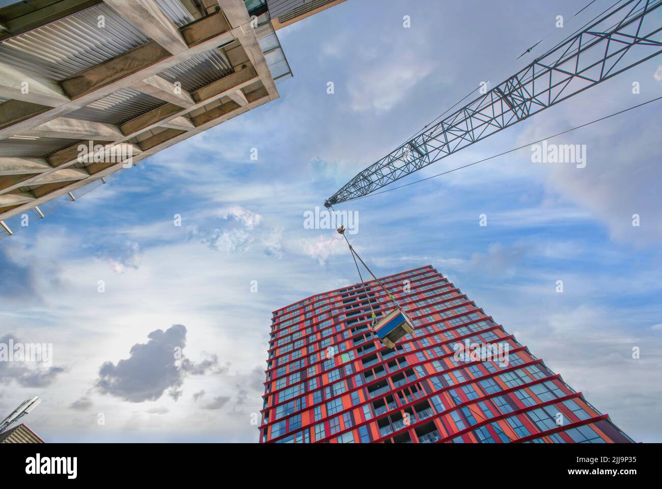 A low angle of cranes and construction sites Stock Photo - Alamy