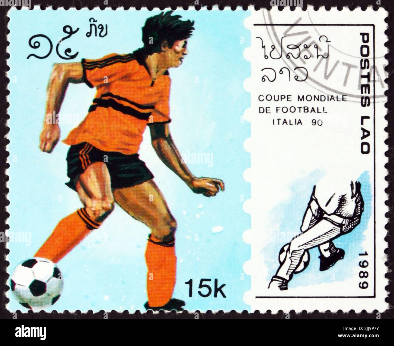 LAOS - CIRCA 1989: a stamp printed in Laos shows soccer player in action, 1990 World Cup Soccer Championships, Italy, circa 1989 Stock Photo